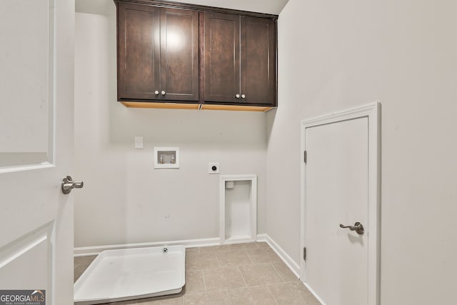 laundry area featuring washer hookup, electric dryer hookup, cabinets, and light tile patterned floors