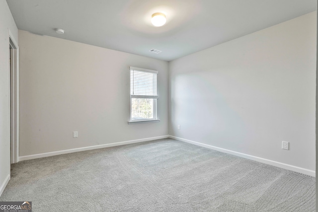 spare room with carpet flooring