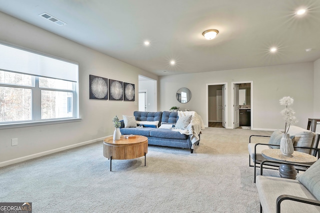 living room featuring light carpet