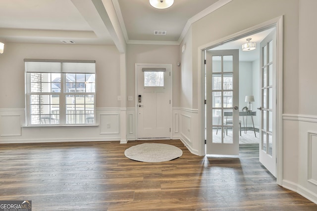 foyer entrance with plenty of natural light, dark wood-type flooring, and french doors