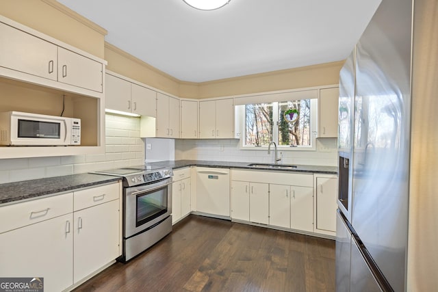 kitchen with tasteful backsplash, stainless steel appliances, crown molding, and a sink