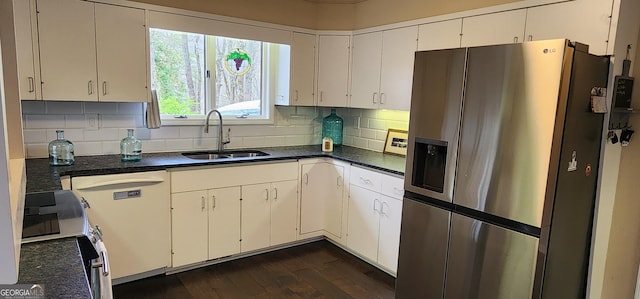kitchen with decorative backsplash, dark wood-style floors, stainless steel electric stove, a sink, and dishwasher