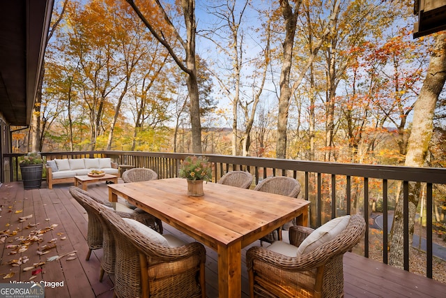 wooden terrace featuring an outdoor hangout area