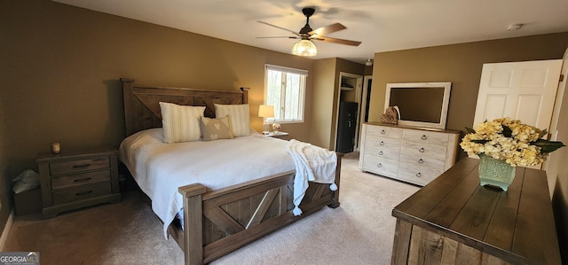 bedroom featuring baseboards, light colored carpet, and visible vents