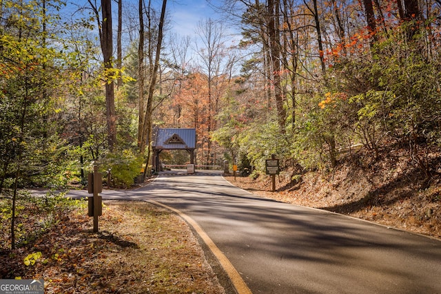 view of street with a forest view