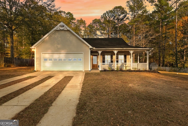 view of front facade with a garage and covered porch