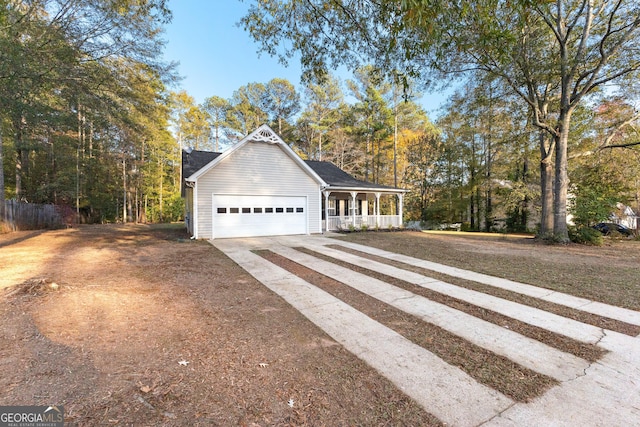 exterior space featuring a porch and a garage