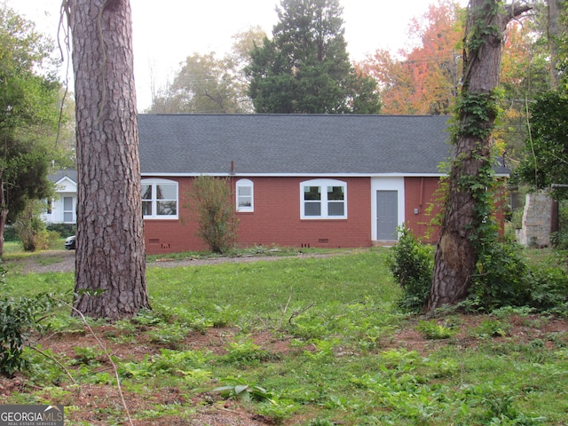 view of side of property with a lawn