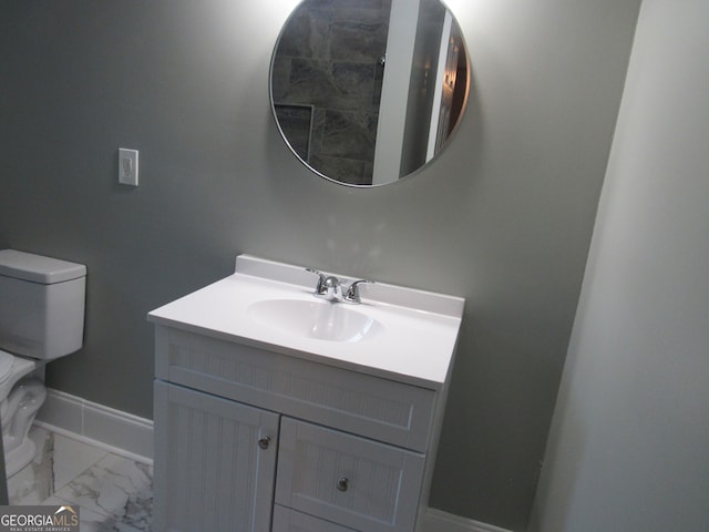 bathroom with vanity and toilet