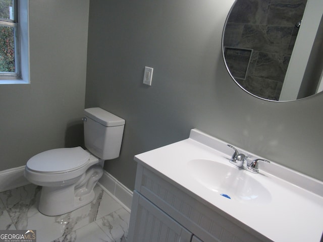 bathroom with vanity and toilet