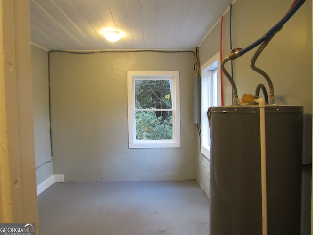 basement featuring water heater and wood ceiling