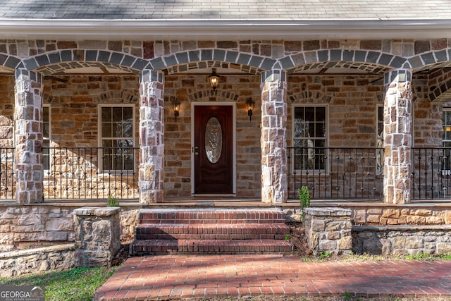 property entrance featuring covered porch