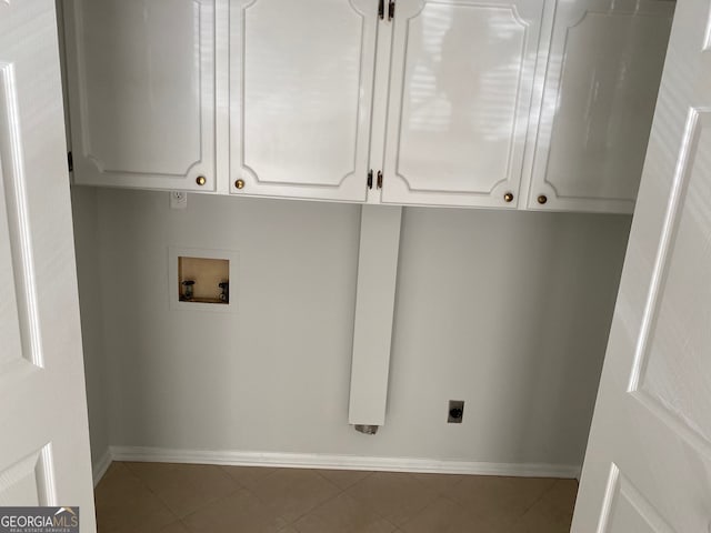 laundry area with washer hookup, hookup for an electric dryer, cabinets, and tile patterned floors