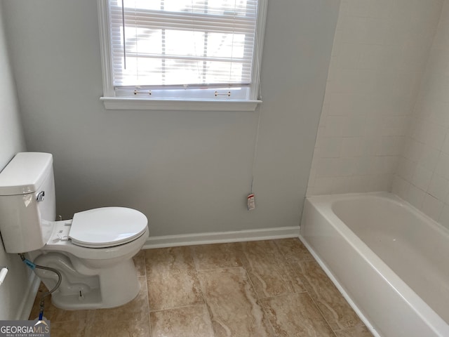 bathroom with a bathtub and toilet