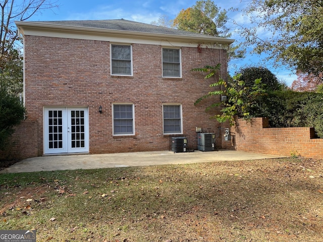 back of house featuring central AC, a patio, and french doors