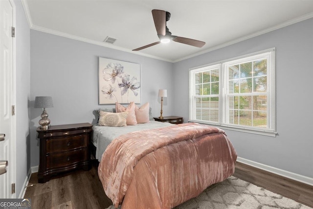 bedroom with ceiling fan, dark hardwood / wood-style floors, and crown molding