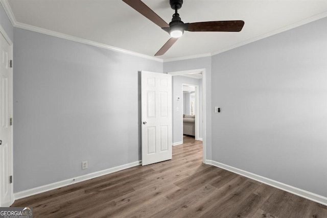 unfurnished bedroom featuring hardwood / wood-style flooring, ceiling fan, and ornamental molding