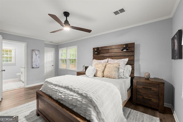 bedroom featuring multiple windows, ceiling fan, and hardwood / wood-style flooring