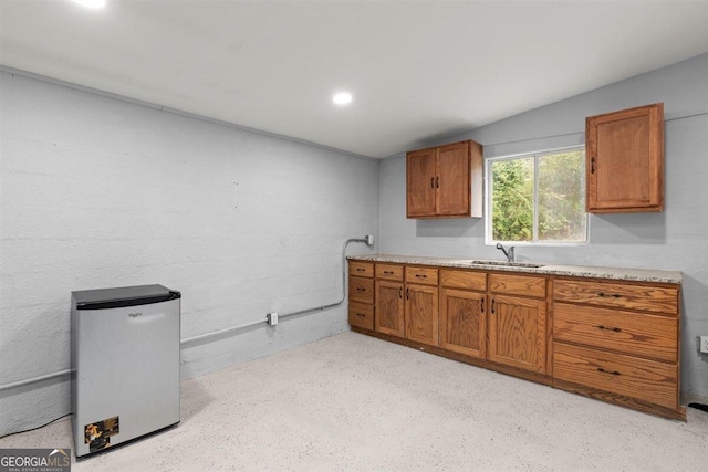 kitchen with refrigerator and sink