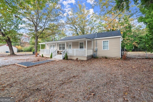 single story home featuring a porch