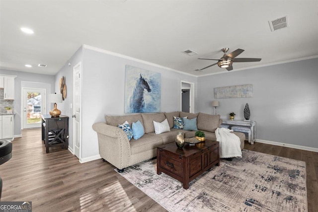 living room with ceiling fan, hardwood / wood-style floors, and ornamental molding