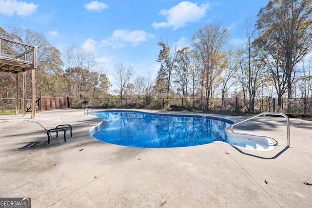 view of swimming pool with a patio area