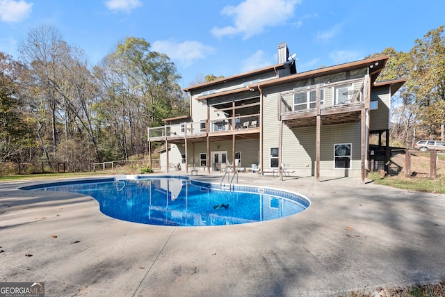 view of swimming pool with a patio