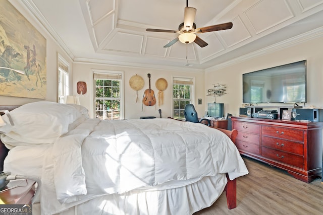 bedroom with ceiling fan, light hardwood / wood-style floors, and crown molding