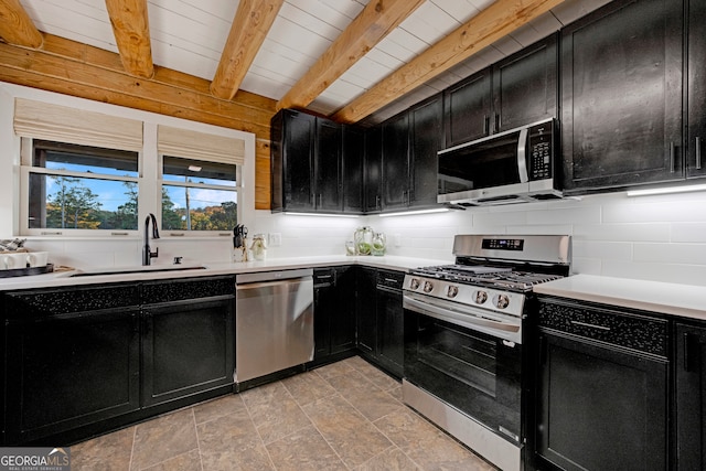 kitchen featuring backsplash, sink, beamed ceiling, and stainless steel appliances