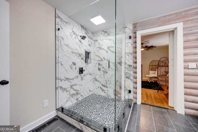 bathroom featuring wood-type flooring and a shower with door