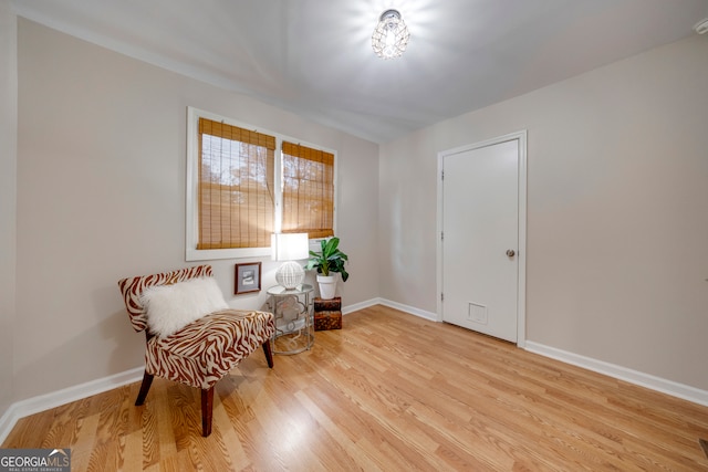 sitting room featuring light hardwood / wood-style floors