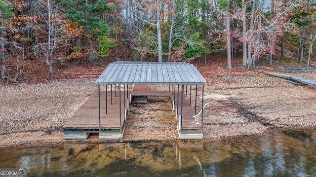 exterior space with a boat dock and a water view