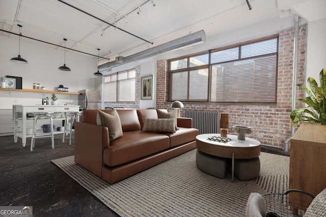 living room with brick wall