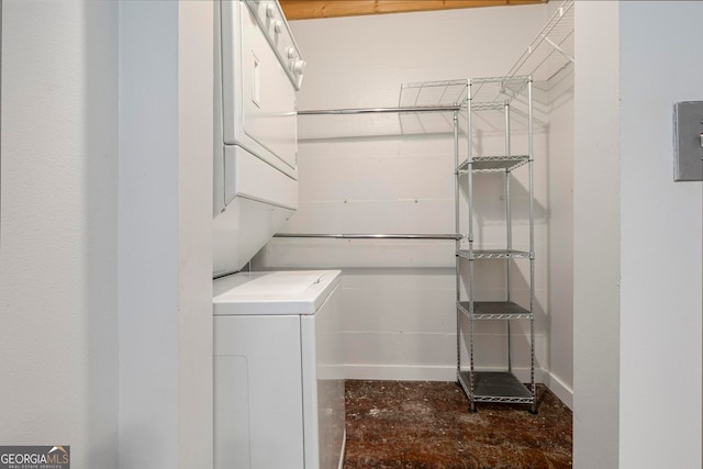 laundry room with stacked washer and dryer