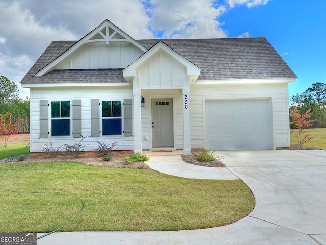 view of front facade featuring a garage and a front lawn