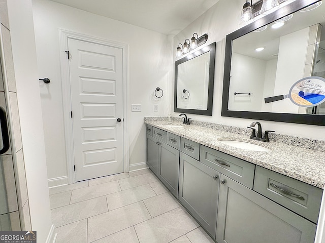 bathroom with tile patterned flooring and vanity