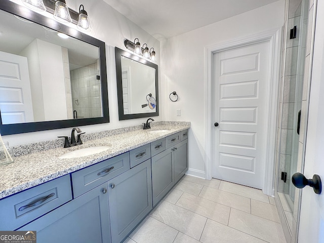 bathroom with tile patterned floors, vanity, and an enclosed shower