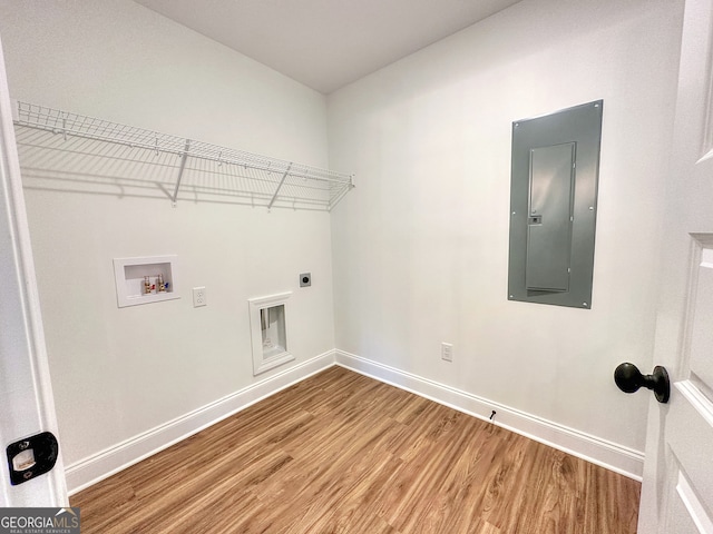 washroom featuring washer hookup, wood-type flooring, electric panel, and electric dryer hookup