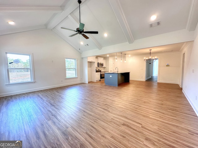 unfurnished living room with wood-type flooring, ceiling fan with notable chandelier, crown molding, and beam ceiling