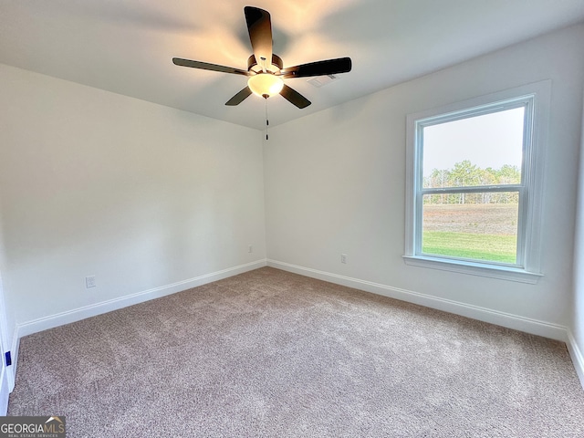 carpeted empty room with ceiling fan