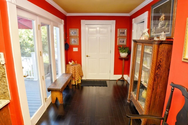 doorway featuring dark hardwood / wood-style flooring and ornamental molding