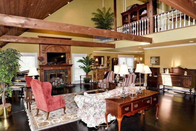 living room with a high end fireplace, dark hardwood / wood-style floors, high vaulted ceiling, and a wealth of natural light