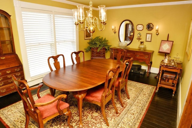 dining space featuring crown molding, an inviting chandelier, and hardwood / wood-style flooring