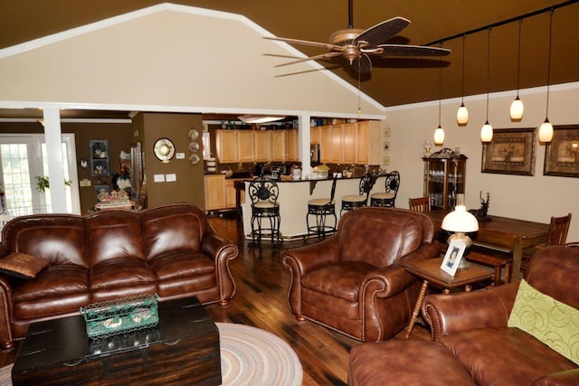 living room featuring hardwood / wood-style flooring, ceiling fan, lofted ceiling, and ornamental molding