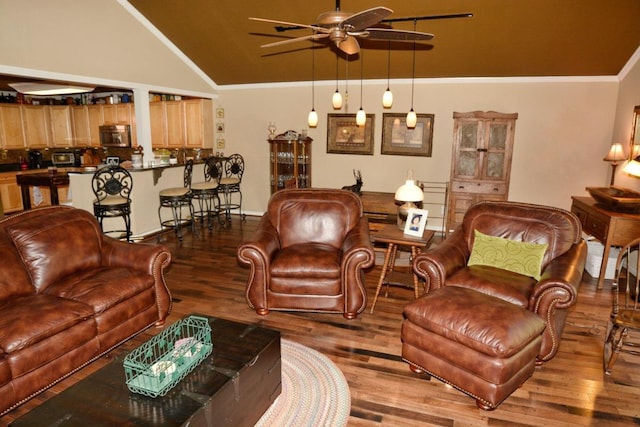 living room with hardwood / wood-style floors, ceiling fan, crown molding, and high vaulted ceiling