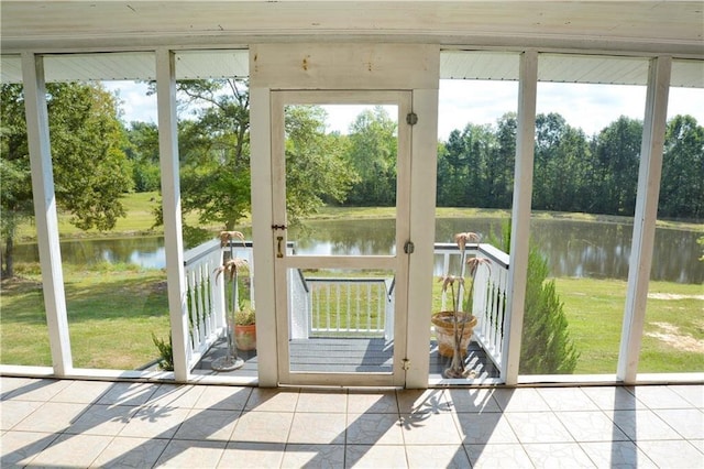 entryway with a water view and light tile patterned floors