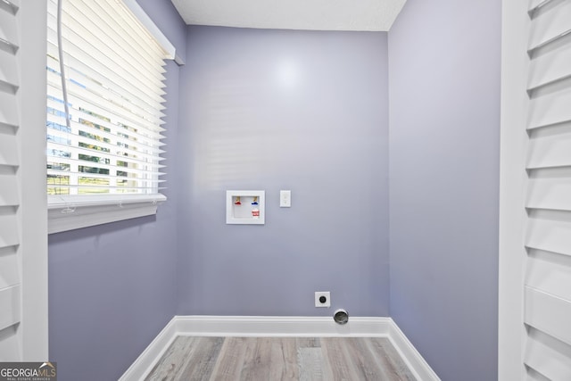 washroom with washer hookup, electric dryer hookup, and wood-type flooring