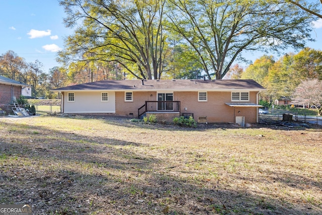 back of house with a lawn