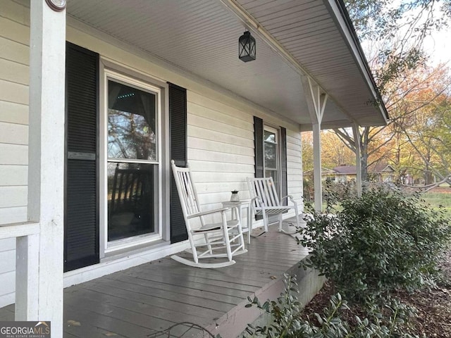 wooden terrace with a porch