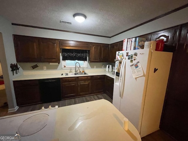 kitchen with dishwasher, white refrigerator with ice dispenser, dark wood-type flooring, sink, and a textured ceiling